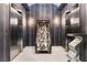 Elegant lobby area with modern seating and stylish decor between two elevator entrances at 200 W Sahara Ave # 4101, Las Vegas, NV 89102