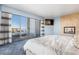 Bright bedroom featuring a fireplace, TV, city view and access to the terrace at 200 W Sahara Ave # 4101, Las Vegas, NV 89102