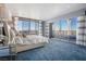 Modern main bedroom with luxury finishes, seating and views of the city skyline at 200 W Sahara Ave # 4101, Las Vegas, NV 89102