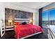 Chic main bedroom features a decorative accent wall and balcony overlooking the cityscape at 200 W Sahara Ave # 4101, Las Vegas, NV 89102