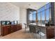 Modern office features a large desk, cabinetry, and stunning city views at 200 W Sahara Ave # 4101, Las Vegas, NV 89102