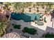 Aerial view showcases a stunning pool area with grotto, plus outdoor kitchen, and multiple balconies at 2540 Red Arrow Dr, Las Vegas, NV 89135