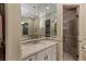Well-lit primary bathroom featuring a glass shower and spacious vanity at 2540 Red Arrow Dr, Las Vegas, NV 89135