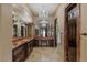 Elegant bathroom with chandelier lighting and well-lit vanity area at 2540 Red Arrow Dr, Las Vegas, NV 89135