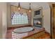 Elegant bathroom with soaking tub, fireplace, and decorative tile work at 2540 Red Arrow Dr, Las Vegas, NV 89135
