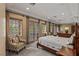 Spacious primary bedroom featuring dual seating areas and natural lighting at 2540 Red Arrow Dr, Las Vegas, NV 89135