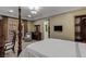 Relaxing bedroom with dark wood trim, designer ceiling, and a view of the backyard at 2540 Red Arrow Dr, Las Vegas, NV 89135