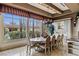 Bright dining area features a grand window view, elegant table seating, and stylish cabinetry at 2540 Red Arrow Dr, Las Vegas, NV 89135