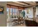 A dining area bathed in natural light with a large window and stylish seating at 2540 Red Arrow Dr, Las Vegas, NV 89135