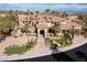 Beautiful home showcasing its impressive stone and stucco exterior, lush greenery, and grand entryway at 2540 Red Arrow Dr, Las Vegas, NV 89135