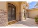 Stunning entryway showcasing an arched entrance and wrought iron double doors at 2540 Red Arrow Dr, Las Vegas, NV 89135