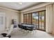 Game room features a poker table, lounge chairs, and floor-to-ceiling window views at 2540 Red Arrow Dr, Las Vegas, NV 89135