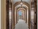 Arched hallway with carpet and views of the balcony at 2540 Red Arrow Dr, Las Vegas, NV 89135