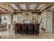 Spacious kitchen with a large island, breakfast bar seating, custom cabinets, and high-end appliances for culinary enthusiasts at 2540 Red Arrow Dr, Las Vegas, NV 89135