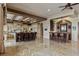 Open-concept kitchen with a large island, bar seating, custom cabinets, and easy access to a second entertaining bar at 2540 Red Arrow Dr, Las Vegas, NV 89135