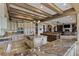 Expansive kitchen showcasing granite countertops, a central island, and an open layout to the living area at 2540 Red Arrow Dr, Las Vegas, NV 89135