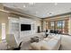 Spacious living room with built-ins, poker table, and large windows with views at 2540 Red Arrow Dr, Las Vegas, NV 89135