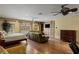 Spacious living area with an open design includes a cozy seating area and hardwood floors at 2540 Red Arrow Dr, Las Vegas, NV 89135