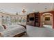 Spacious main bedroom with large windows, custom built-ins, and archway at 2540 Red Arrow Dr, Las Vegas, NV 89135