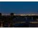Striking night view of the Las Vegas skyline from a rooftop vantage point, showcasing city lights at 2540 Red Arrow Dr, Las Vegas, NV 89135
