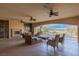 Expansive outdoor patio with comfortable seating, fireplace, and scenic views at 2540 Red Arrow Dr, Las Vegas, NV 89135