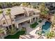 Aerial view of a luxurious pool with a grotto and outdoor seating area at 2540 Red Arrow Dr, Las Vegas, NV 89135