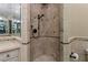 Detailed stonework and shower stall seating is featured in this bathroom at 2540 Red Arrow Dr, Las Vegas, NV 89135