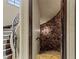 Unique staircase leading to a stone-walled area, adding architectural interest to the home at 2540 Red Arrow Dr, Las Vegas, NV 89135