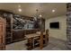 Finished wine cellar with custom cabinetry, bar area, and a modern television at 2540 Red Arrow Dr, Las Vegas, NV 89135