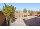 Landscaped backyard with brick paver area, desert landscaping, and block wall for privacy at 2824 Shadows Edge Ct, Henderson, NV 89052