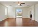 Bright bedroom with hardwood floors, ceiling fan and access to the balcony at 2824 Shadows Edge Ct, Henderson, NV 89052