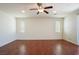 Inviting bedroom features hardwood floors, ceiling fan and dual windows at 2824 Shadows Edge Ct, Henderson, NV 89052