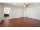 Spacious bedroom with hardwood floors and an open doorway to the bathroom at 2824 Shadows Edge Ct, Henderson, NV 89052