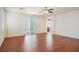 Spacious bedroom with hardwood floors and large sliding glass doors to the balcony at 2824 Shadows Edge Ct, Henderson, NV 89052