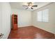 Bedroom featuring a ceiling fan, hardwood floors, and a window at 2824 Shadows Edge Ct, Henderson, NV 89052
