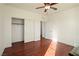 A bedroom featuring hardwood floors, closet space and natural light at 2824 Shadows Edge Ct, Henderson, NV 89052