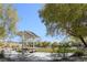 Community park featuring covered picnic tables, green lawns, and mature shade trees at 2824 Shadows Edge Ct, Henderson, NV 89052