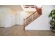 Stunning home entrance showcasing a staircase with wood banisters, tile floors, and bright open space at 2824 Shadows Edge Ct, Henderson, NV 89052