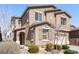 Two-story home with desert landscaping, covered porch, and two-car garage at 2824 Shadows Edge Ct, Henderson, NV 89052