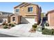 Well-maintained two-story home with a two-car garage and landscaped front yard at 2824 Shadows Edge Ct, Henderson, NV 89052