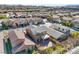 Beautiful two-story home featuring a balcony, desert landscaping, and a tile roof in a vibrant suburban neighborhood at 2824 Shadows Edge Ct, Henderson, NV 89052