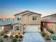 Charming two-story home features a well-maintained front yard and attached two-car garage, perfect for suburban living at 2824 Shadows Edge Ct, Henderson, NV 89052