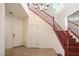 Bright foyer with tile flooring, staircase, and neutral paint palette at 2824 Shadows Edge Ct, Henderson, NV 89052