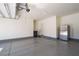 Clean two-car garage with epoxy flooring and a stainless steel refrigerator at 2824 Shadows Edge Ct, Henderson, NV 89052