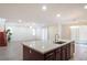 This spacious granite kitchen island features a stainless steel sink, storage space, and modern fixtures at 2824 Shadows Edge Ct, Henderson, NV 89052