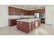This kitchen features stainless steel appliances, granite counters, and a large island perfect for entertaining at 2824 Shadows Edge Ct, Henderson, NV 89052