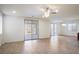 Expansive living room with tile flooring, recessed lighting, ceiling fan, and sliding doors, perfect for entertaining at 2824 Shadows Edge Ct, Henderson, NV 89052