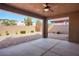 Covered patio area featuring concrete and brick flooring, with ceiling fan and block wall surround at 2824 Shadows Edge Ct, Henderson, NV 89052