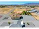 Wide aerial shot showcases the surrounding area and the property's extensive gravel lot at 3080 S Prairie Ave, Pahrump, NV 89048