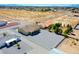 Beautiful aerial view of a property with a large gravel lot and desert landscaping at 3080 S Prairie Ave, Pahrump, NV 89048